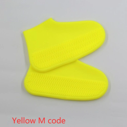 Yellow silicone rain boots, slip-resistant and easy to carry, perfect for hiking.