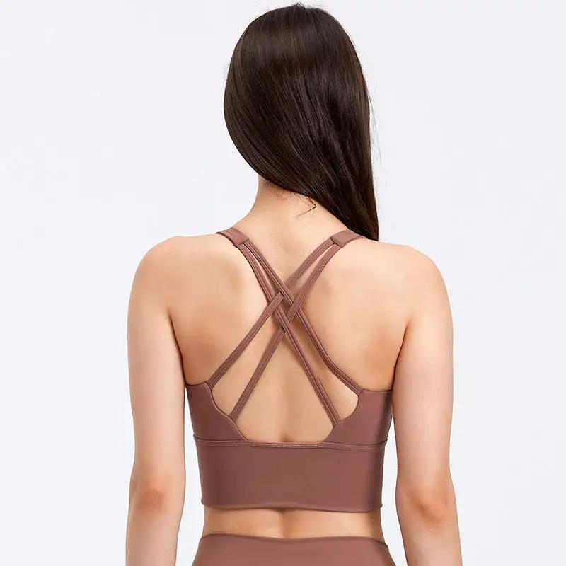 Women's fitness running yoga bra with crisscross back design in a plain pattern.