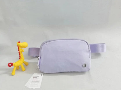 Crossbody backpack in light purple with zipper, suitable for yoga and fitness activities.