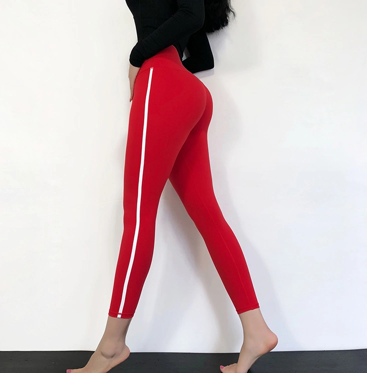 Red fitness pants designed for optimal comfort and flexibility during yoga and workouts.