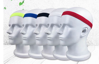 Five mannequin heads wearing fitness yoga hair bands in fluorescent green, blue, black, white, and red.