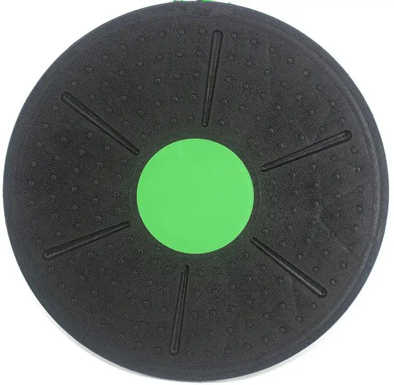 Black and green fitness balance board made of engineering plastic.