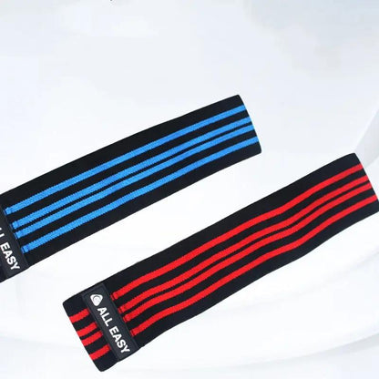 Yoga fitness elastic tension bands in red and blue for training and sports.