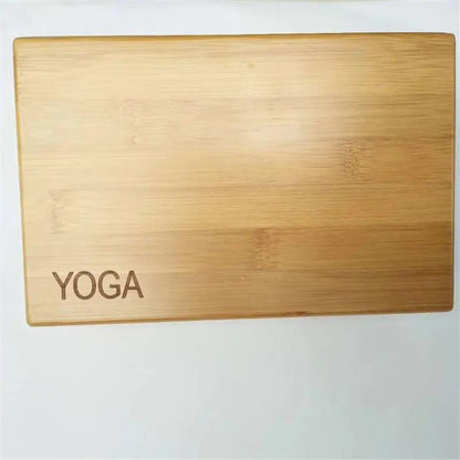 Bamboo and wood yoga brick with "YOGA" text, dimensions 23x15x7.6 cm, made from cork.