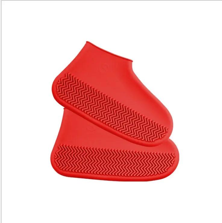 Silicone rain boots, slip-resistant, easy to carry for men and women hiking in red.