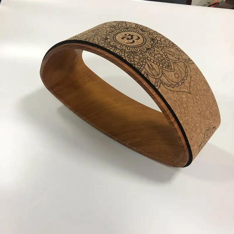 Cork yoga wheel half-round backbend yoga ring with mandala design.