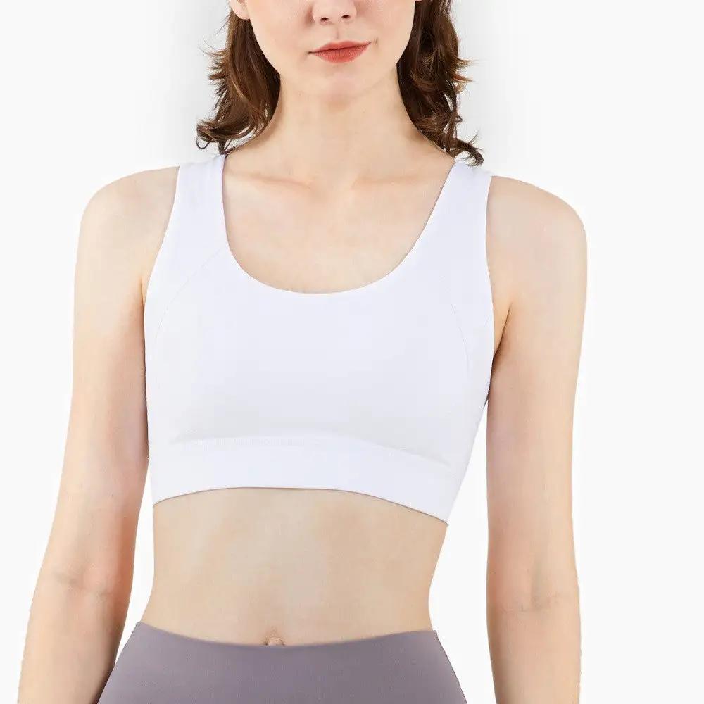 Women's fitness sports underwear yoga bra in white, sporty style suitable for activities like running, fitness, cycling, and dance. Made from NULS Air nylon fabric.