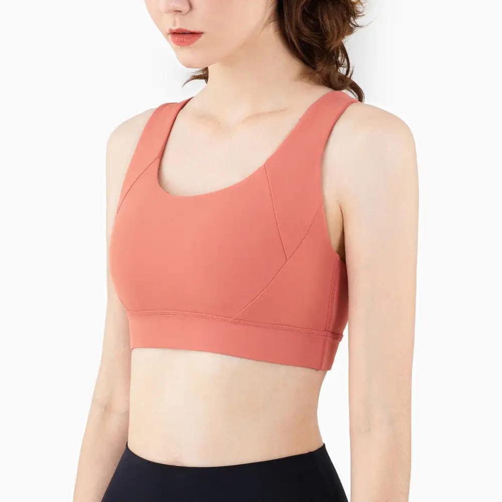 Fitness sports underwear yoga bra in coral, sporty style for various activities.