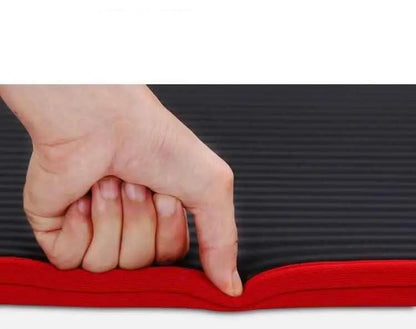 Hand pressing on a 10mm thick yoga mat showing cushioning and thickness.