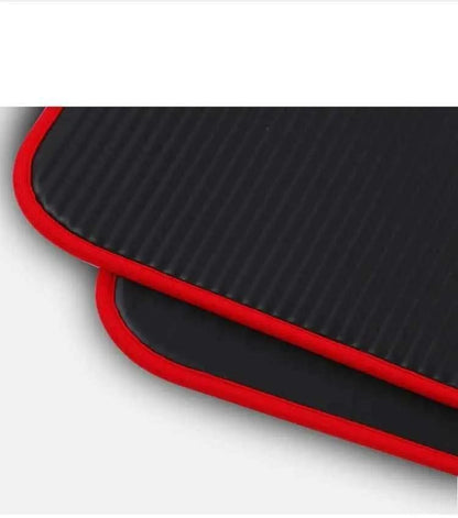 10mm thick yoga mats with black surface and red edge detailing.