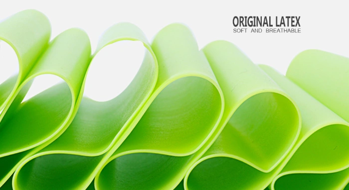 Green yoga stretch band made of natural latex, soft and breathable, rolled up.