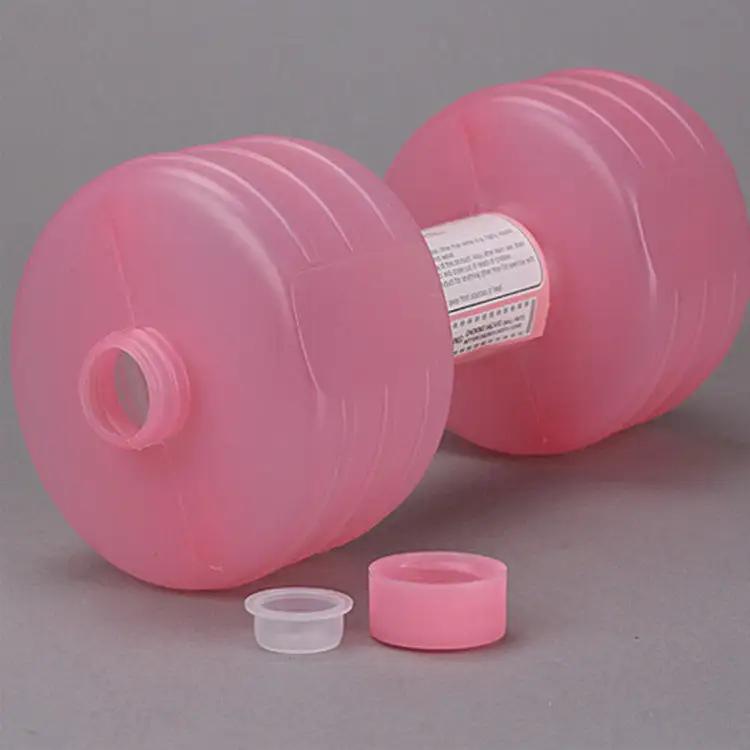 Pink body building water dumbbell bottle for fitness and hydration.