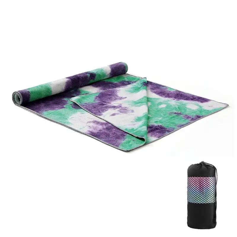 Tie-dye yoga blanket pad towel with purple and green design, includes carrying bag.