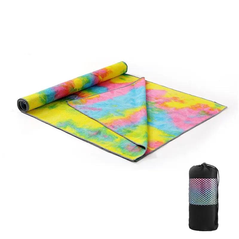 Colorful tie-dye yoga blanket pad towel with net bag, lightweight and absorbent design for support and comfort in fitness activities.