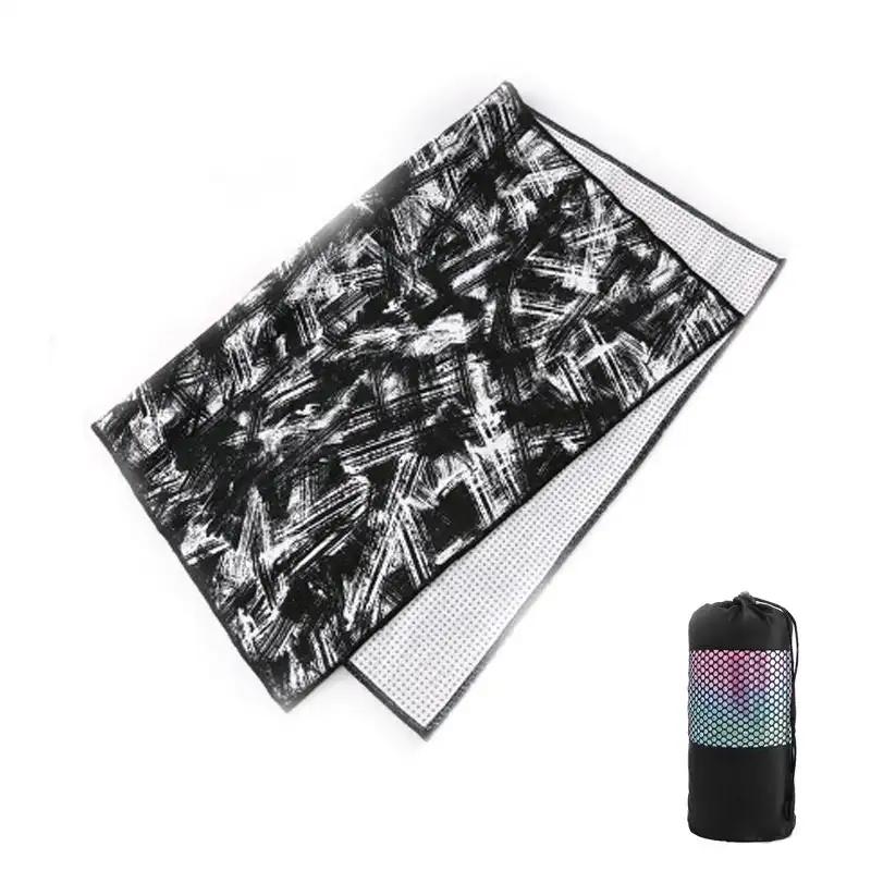 Tie-dye yoga blanket pad towel featuring black and white abstract design with net bag.