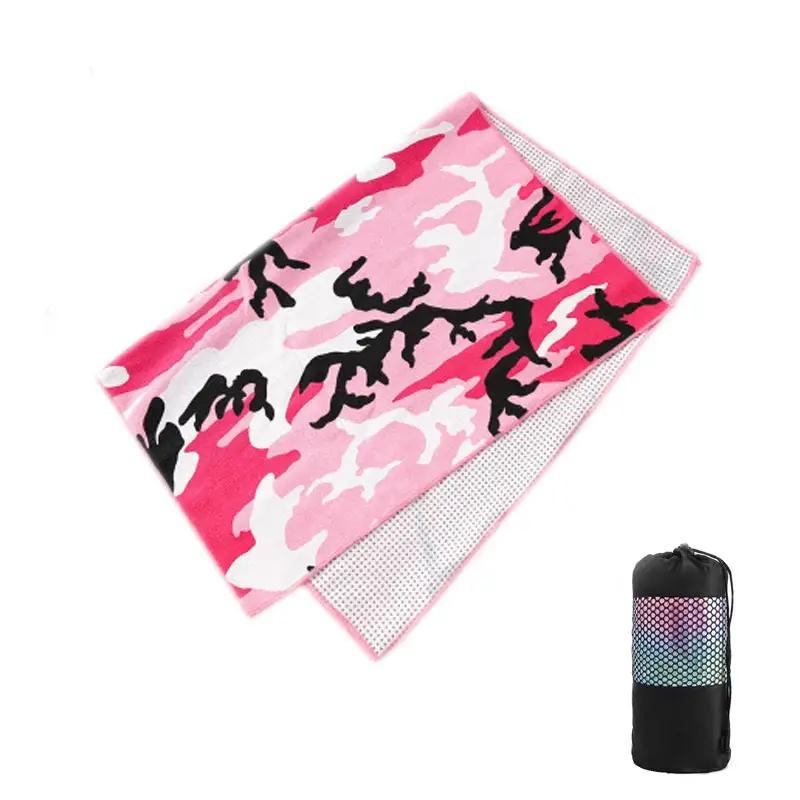 Tie-dye yoga blanket pad towel with vibrant pink and black design, shown with carrying bag.