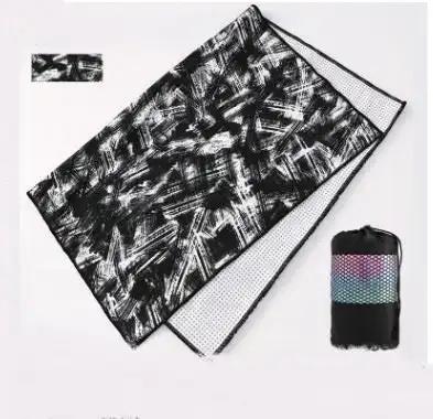 Tie-dye yoga blanket pad towel in black and white with net bag.