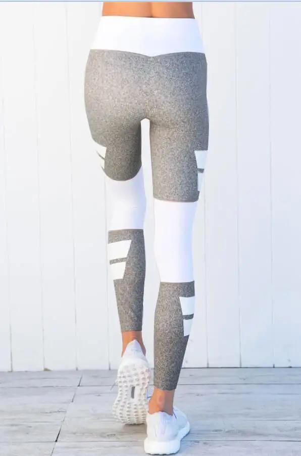 Color matching yoga fitness yoga pants in gray and white, rear view.