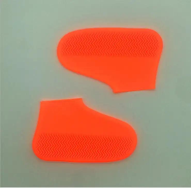 Silicone rain boots for hiking, slip-resistant and easy to carry, in bright neon orange.