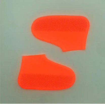 Silicone rain boots for hiking, slip-resistant and easy to carry, in bright neon orange.