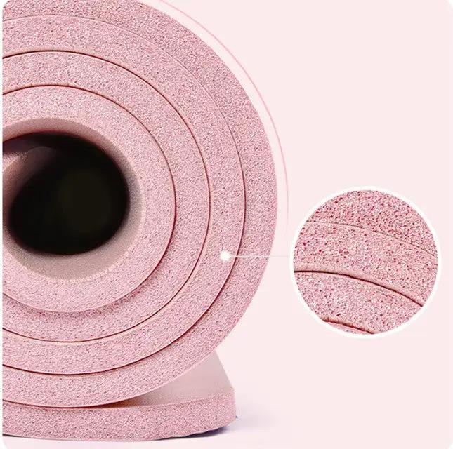 Pink TPE yoga mat roll for home fitness, widened design.