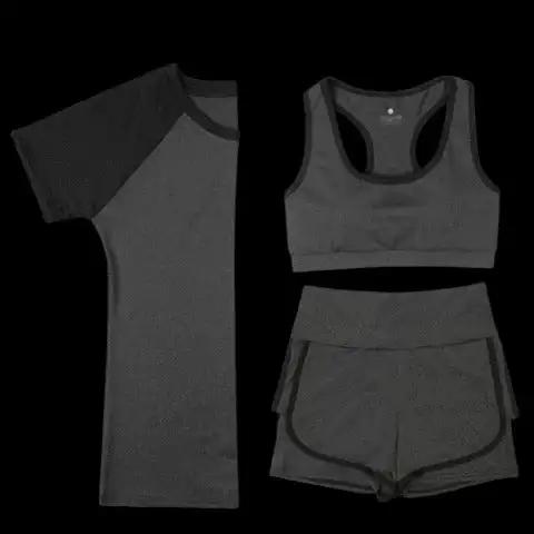 Black cotton yoga fitness three-piece set including top, bra, and shorts.