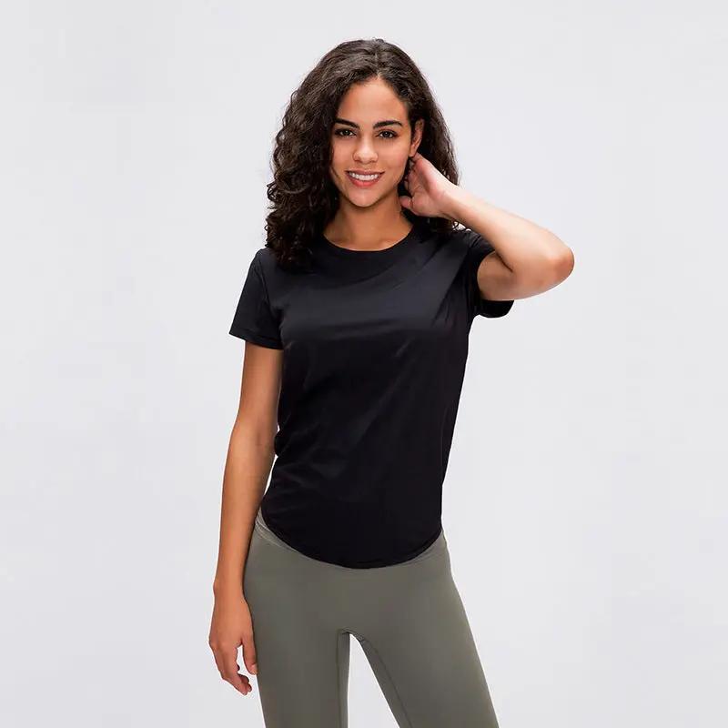 Female model wearing a plain cotton-blend yoga fitness T-shirt in black, suitable for all seasons.