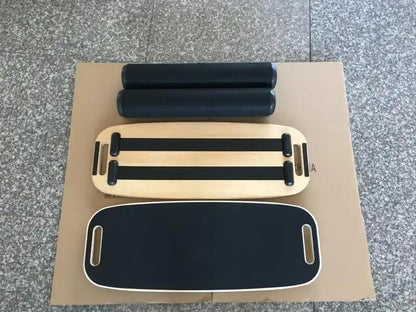 Home fitness balance board with roller components.