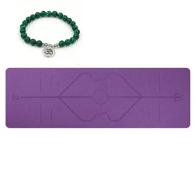 Purple TPE yoga mat with printed position lines, shown with green beaded bracelet.