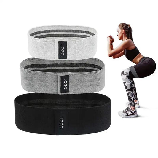 Fitness squat resistance rings in gray and black with a woman doing squats in workout attire.