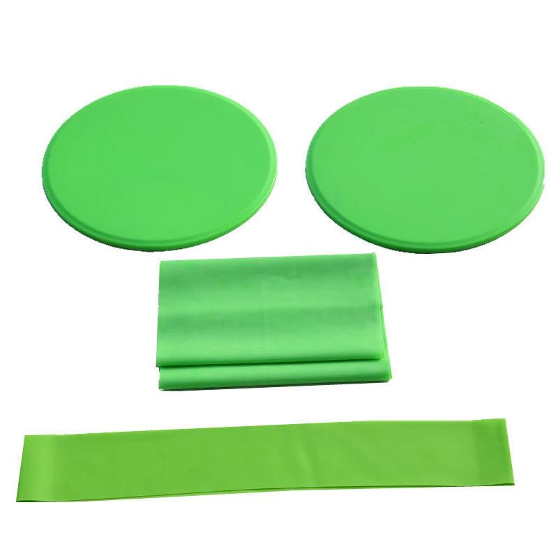 Green yoga fitness three-piece set with sliding discs, tension band, and resistance ring.