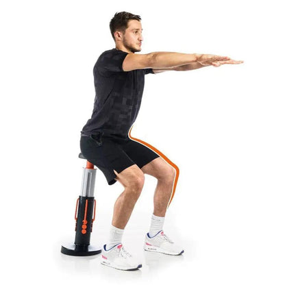 Man using Magic Fitness Exercise Hip Trainer for squats and core workout.