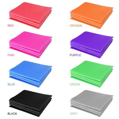 Non-slip yoga mat in multiple colors: red, orange, pink, purple, blue, green, black, and gray; foldable design with high-density foam cushioning.