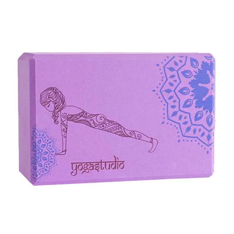 Purple yoga brick with mandala design for fitness and balance.