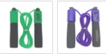 Green and purple rope skipping fitness ropes with sponge handles.