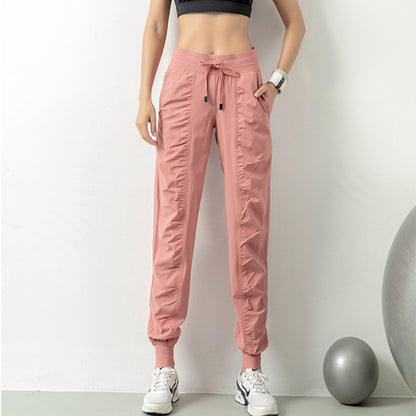 WILKYsPantsFashion Casual Sports Pants For Women Drawstring High Waist Trousers WExperience ultimate comfort and style with our Fashion Casual Sports Pants for Women. Designed with a drawstring high waist, and pockets, these pants are perfect for