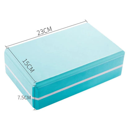 Two-color yoga brick with measurements 7.5x15x23cm in turquoise and white, made of eco-friendly EVA.