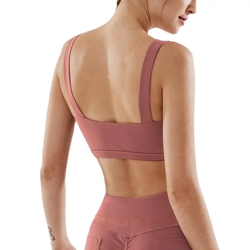 Woman wearing fitness yoga underwear set, nylon fabric, pink color.