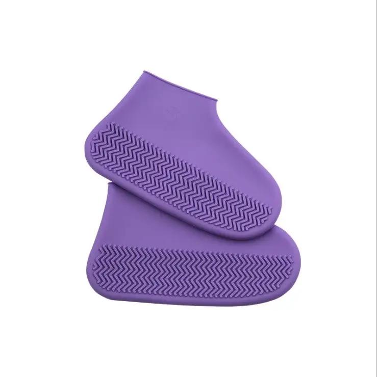 Purple silicone rain boots for hiking, slip-resistant, lightweight, and easy to carry.