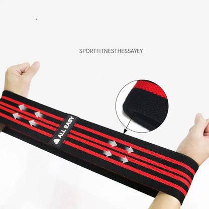 Yoga fitness training elastic band for tension exercises with red and black design.