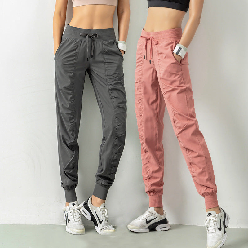 WILKYsPantsFashion Casual Sports Pants For Women Drawstring High Waist Trousers WExperience ultimate comfort and style with our Fashion Casual Sports Pants for Women. Designed with a drawstring high waist, and pockets, these pants are perfect for