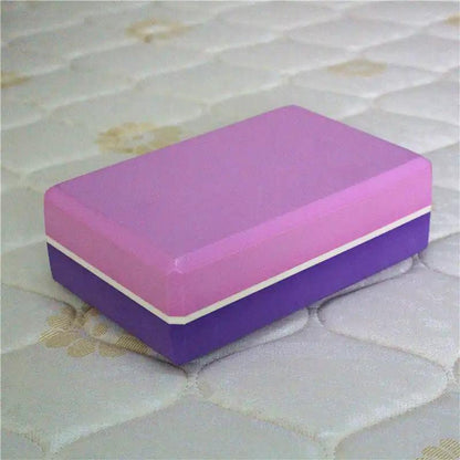 Two-color yoga brick with pink and purple design for balance and support.