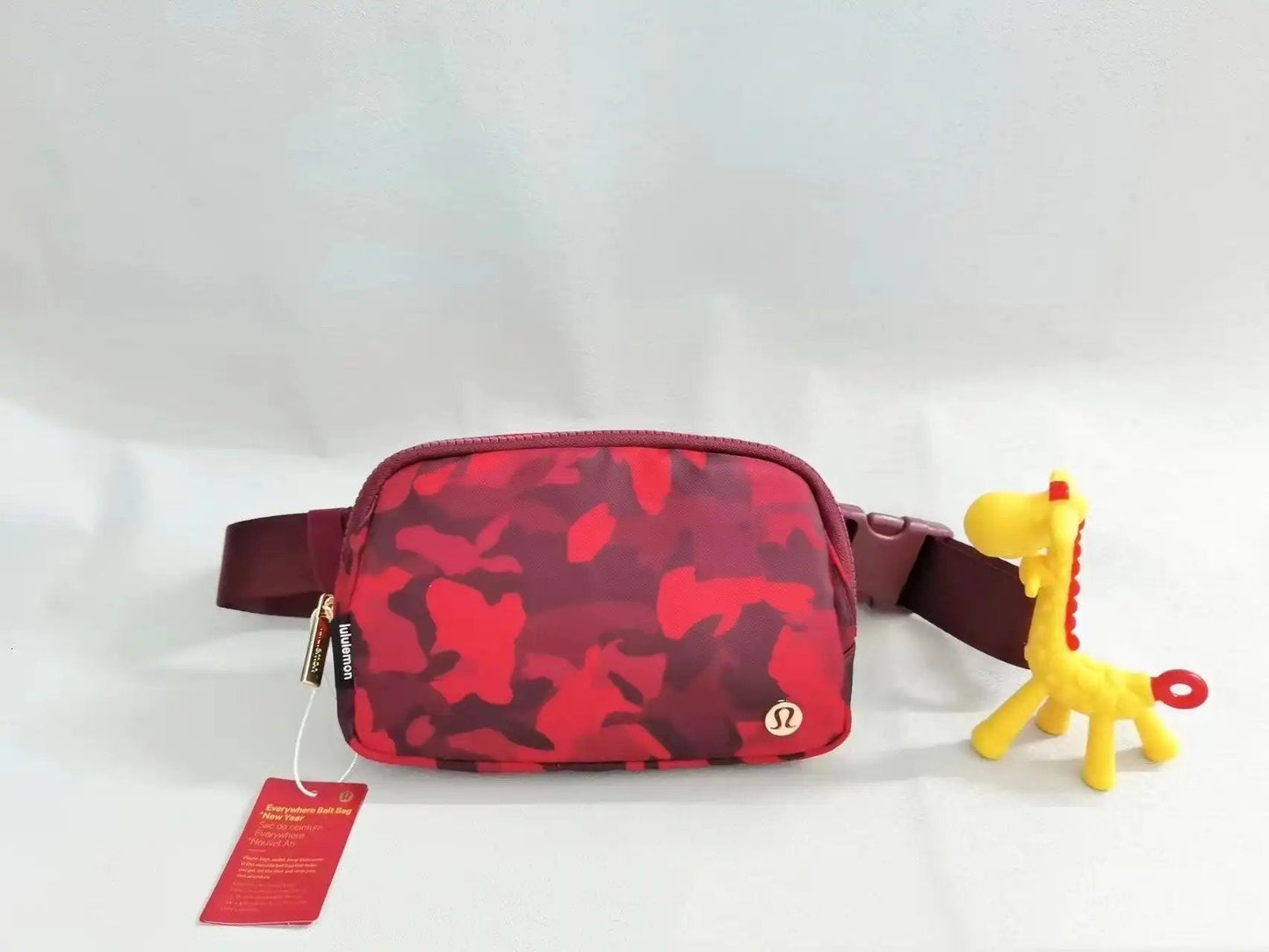 Red crossbody backpack with camouflage design, suitable for yoga and fitness sports.