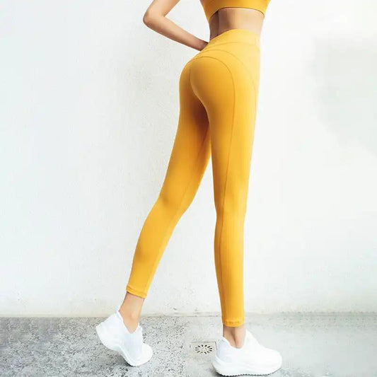 High waisted yellow yoga pants for running and fitness activities.