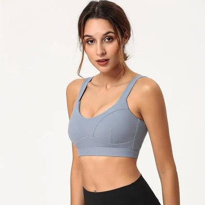 Blue nylon yoga beauty back fitness bra modeled.