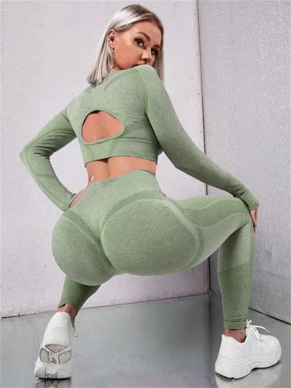 WILKYsSweat Suit2pcs Sports Suits Long Sleeve Hollow Design Tops And Butt Lifting HighThe 2 pcs sportss suit perfect for any workout.  The suit is made of high-quality, moisture-wicking fabric that keeps you cool and dry. The elastic waistband ensures