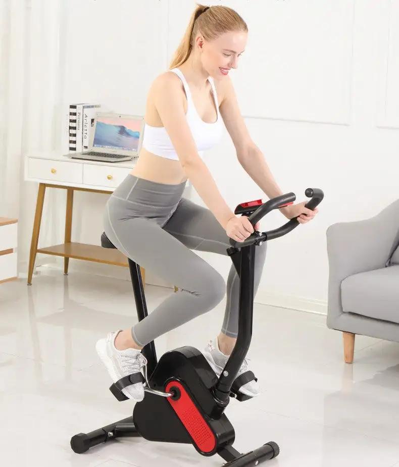 Exercise bike with webbing in use for home workout.