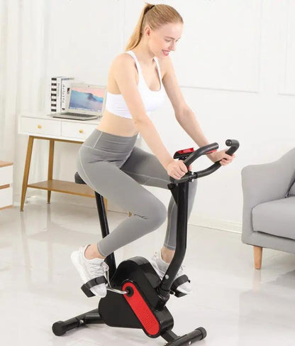 Exercise bike with webbing in use for home workout.