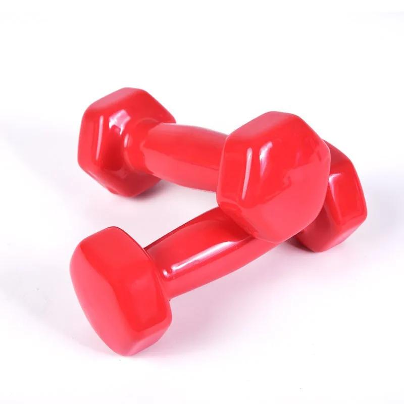 Red adjustable dumbbells for home arm reduction and yoga workouts.