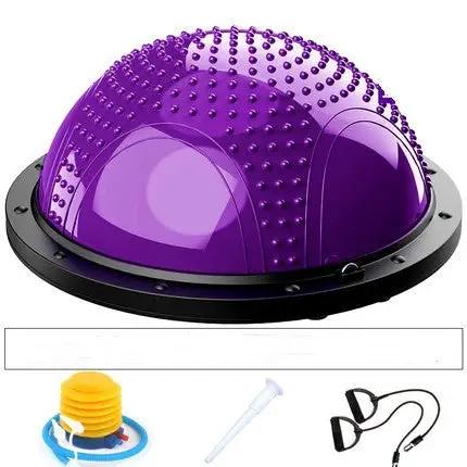 Pilates and yoga ball with accessories for fitness exercises.